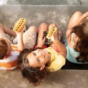 Lifestyle of kids eating hot dogs